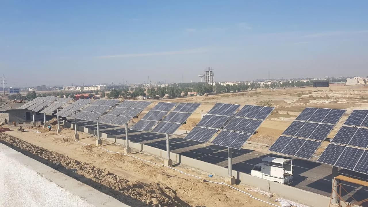 Ground-mounted solar arrays beside the Lahore Ring Road