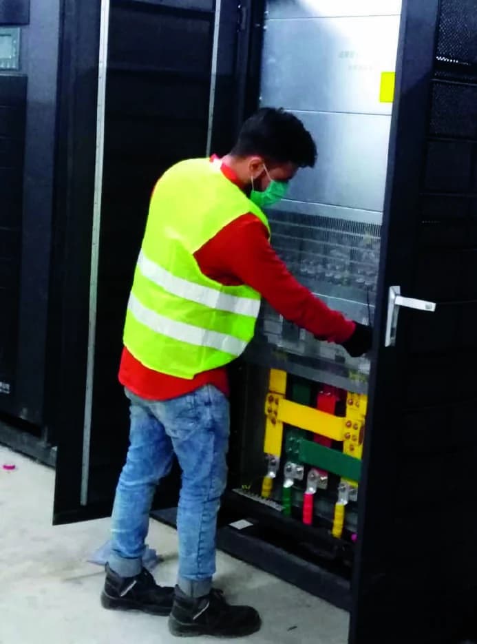 Baykee technician working on a critical power system